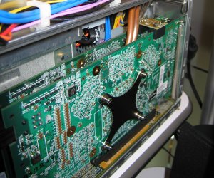 The heatpipe from each GPU is shown here, and pushes the heat to a twin-fan heat exchanger located at the back