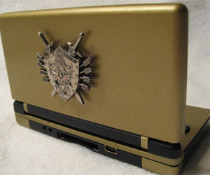 The Zelda DS Lite comes with a customised charging stand and backlit emblem on the lid.
