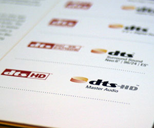 The new DTS logo on the right, versus the red one we used to know.