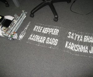 The printer robot in action.  No mention is made of who had to clean up the mess afterwards.