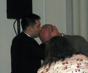 Timothy Chen, Special Assistant to VIA's CEO, plants a smacker right on Drew Henry's forehead.  A sign of true love...
